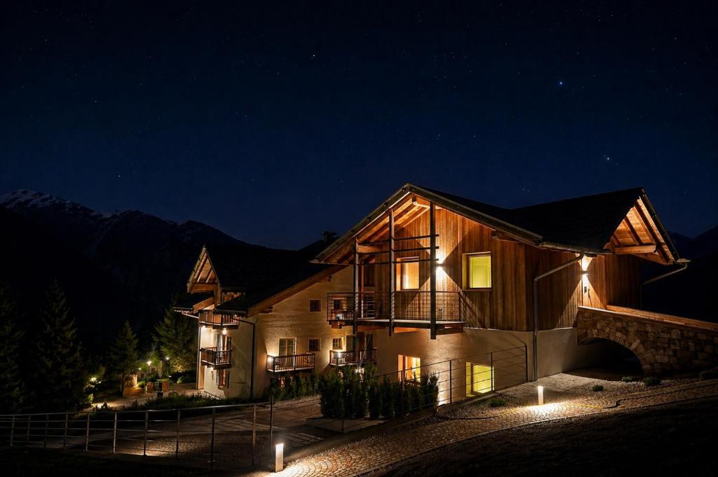 a house at night with lights in front of it at Garnì Lilly in San Lorenzo in Banale