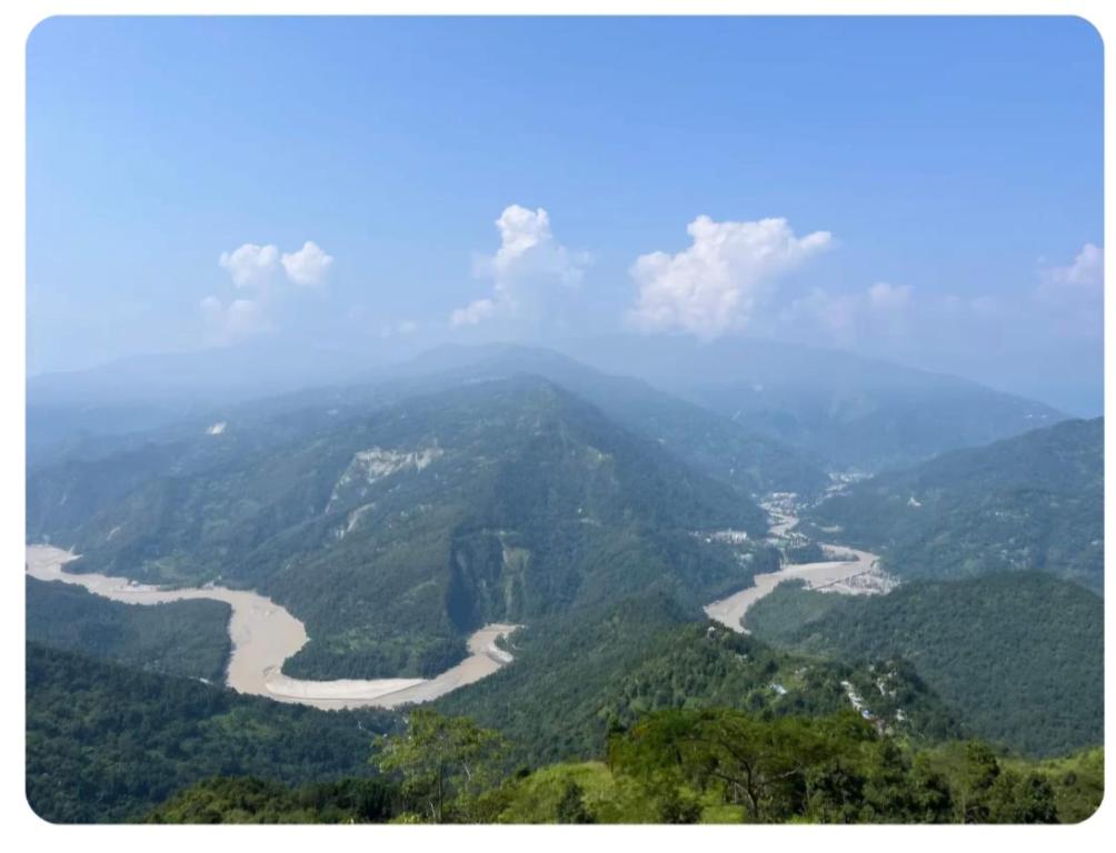a view of a river from a mountain at Chamling Retreat in Kalimpong