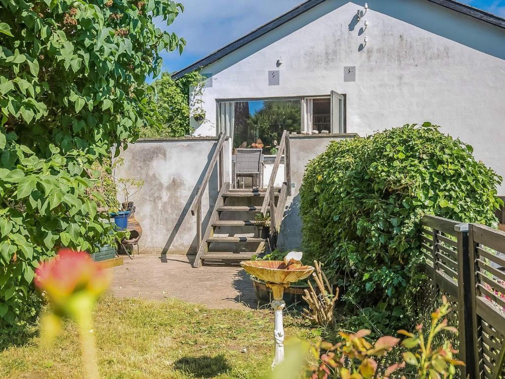 a stairway leading up to a house with a porch at 6 person holiday home in Borre in Borre
