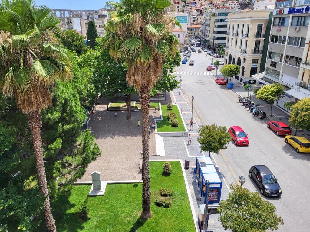 a view of a city street with palm trees at Castle View #3-4 in Kavála