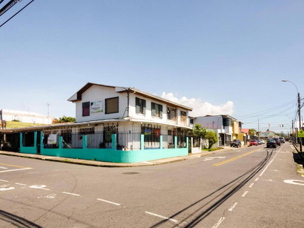 a building on the side of a street at In the Wind Hostel and Guesthouse in San José