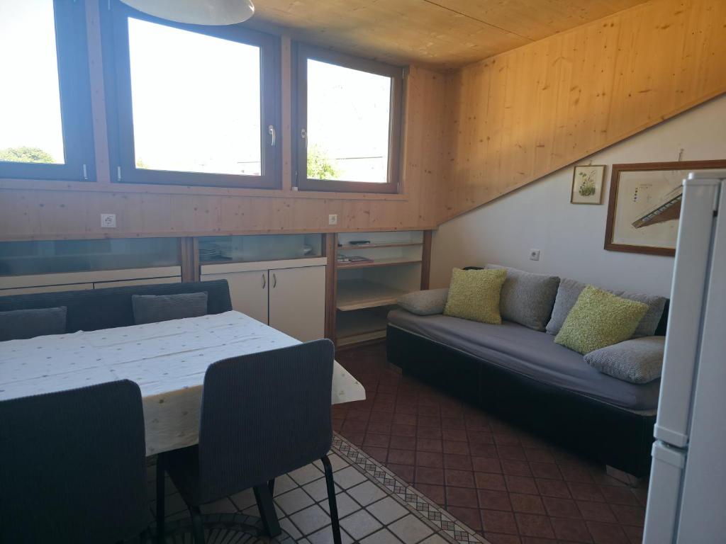 a living room with a couch and a table at Ferienwohnungen JoJaSa in Laces