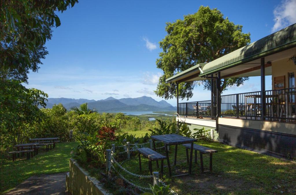 a group of picnic tables on the side of a building at Vista Hinchinbrook in Cardwell