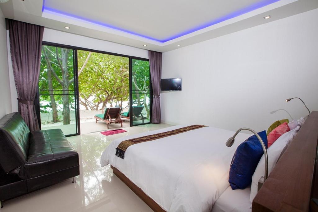 Postel nebo postele na pokoji v ubytování Paradise Resort Phi Phi