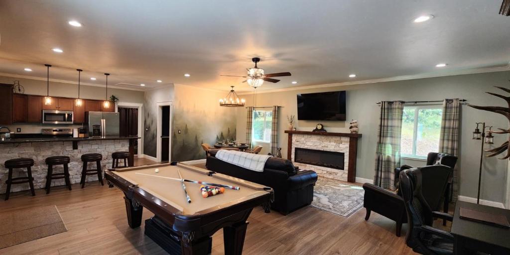 a living room with a pool table in it at The fancy Shanty in Pilot Hill