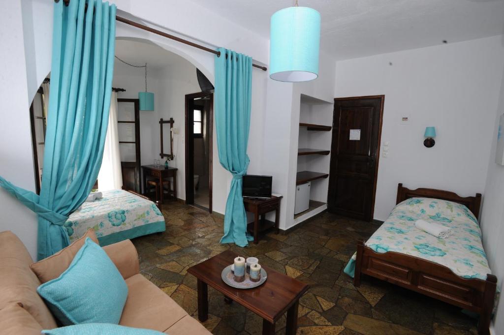 Postel nebo postele na pokoji v ubytování Elli Hotel