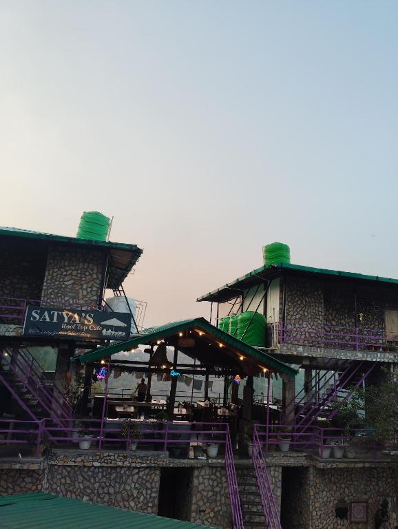 a building with a ride with purple stairs at Magnetic Ridge Kasar in Hawālbāgh