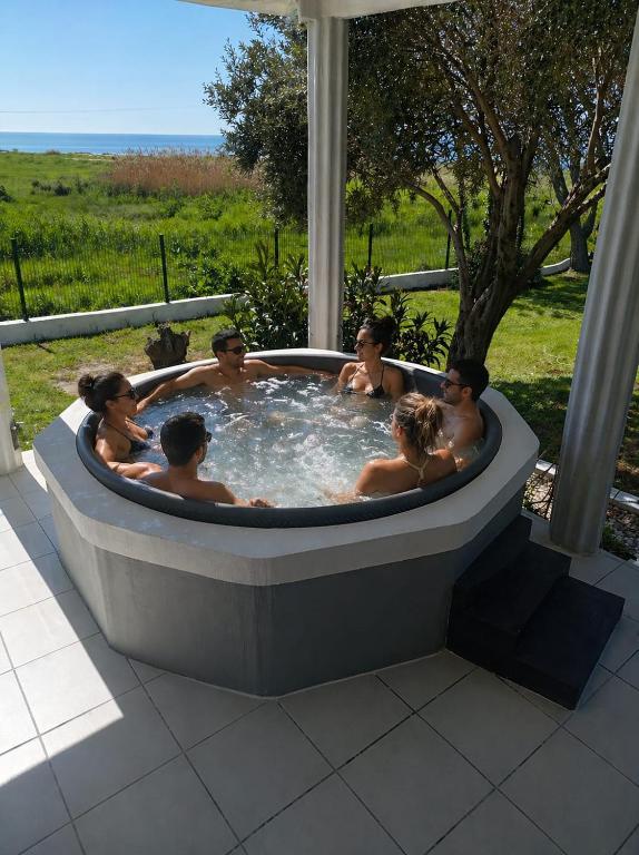 a group of people in a hot tub at Blue Horizon in Sevastí