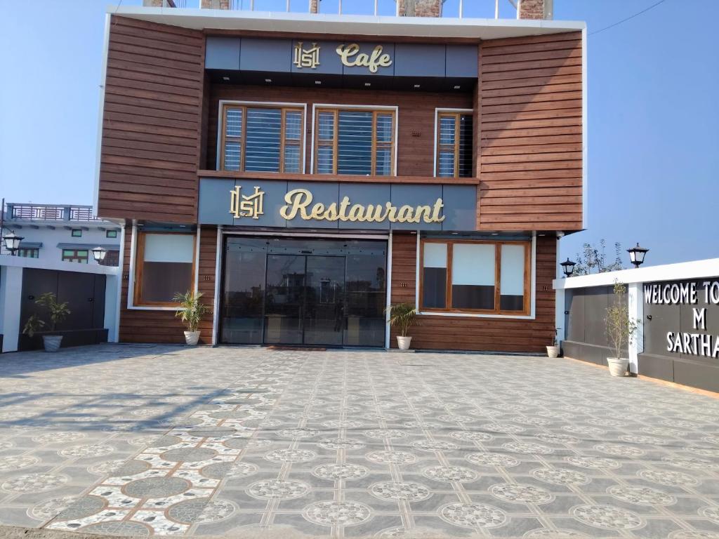 a building with a sign that reads hell restaurant at Hotel M Sarthak Dehradun in Dehradun