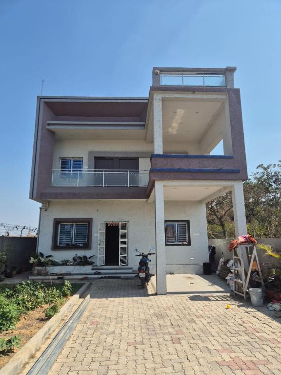 a house with a driveway in front of it at Ashirwad Niwas in Bokāro