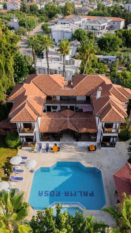 an aerial view of a resort with a swimming pool at Palma Rosa Hotel in Kemer