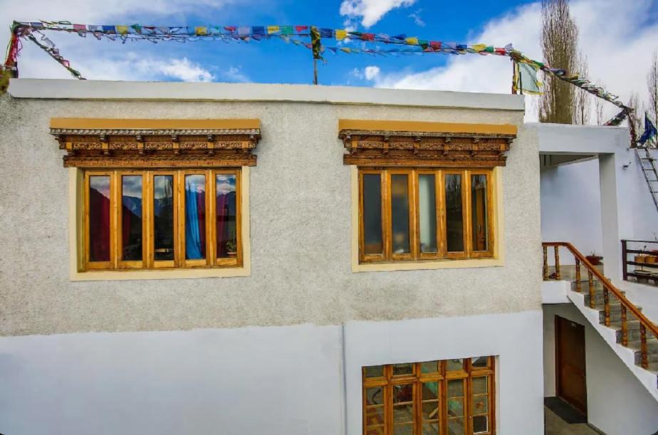 a house with two windows and a staircase at Stendel Villa Fort Road, Leh in Leh
