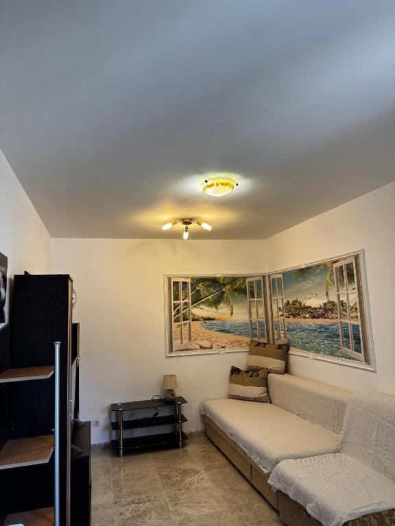 a living room with a couch and a table at Apartman Tafra1 in Igalo