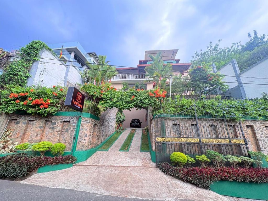 a house with flowers on the side of it at Lanthana Villa Kandy in Kandy