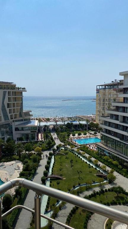 a view of a park with the ocean in the background at Mare Nostrum Residence in Shëngjin