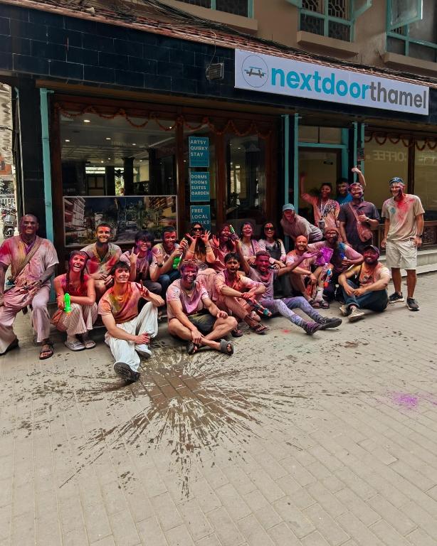 a group of people sitting in front of a building at Nextdoor Thamel in Kathmandu