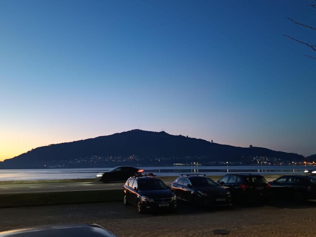 a group of cars parked in a parking lot at O Fernando in Caminha