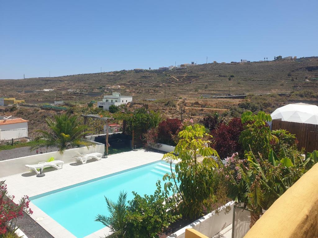 a view of the pool from the house at Kamer Appartement in Arico in La Sabinita