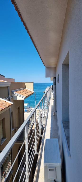 a balcony with a view of the ocean from a hotel at Abbronzatissima Capo d'Orlando in Capo dʼOrlando