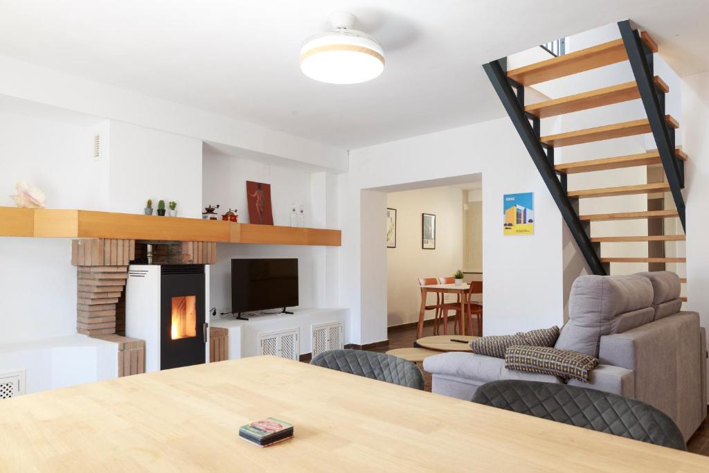 a living room with a couch and a table at Duplex con vistas en el centro de Aracena in Aracena