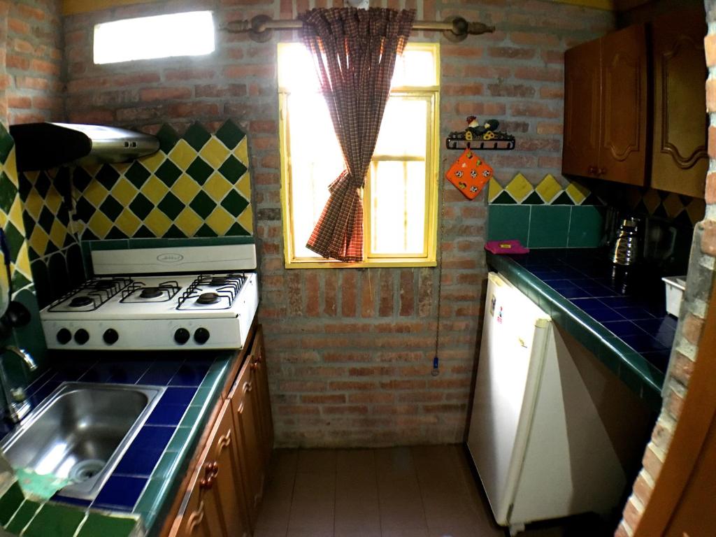 Cuina o zona de cuina de Cabañas La Carolina - Mesa de Los Santos