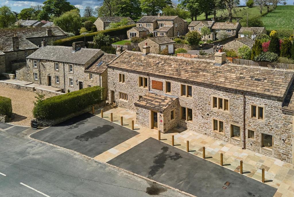 an overhead view of an old stone house with a street at The Angel at Hetton in Hetton