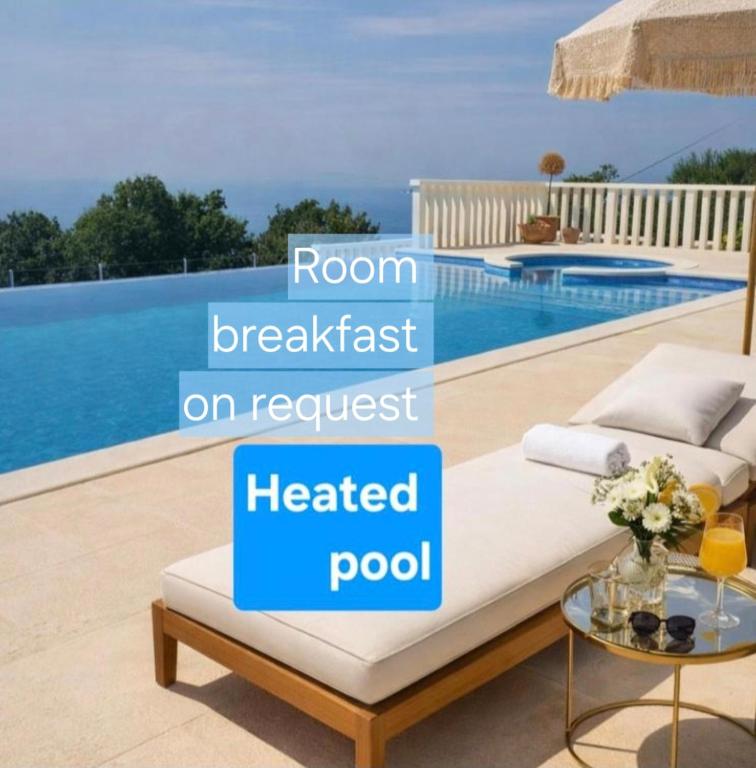 a room breakfast on request heated pool in a house at Villa Conte in Podstrana