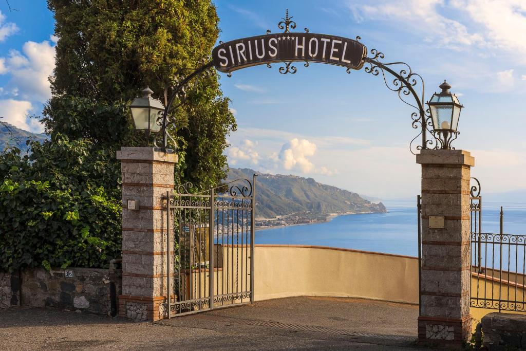 a gate with a sign that reads stius house at Hotel Sirius in Taormina