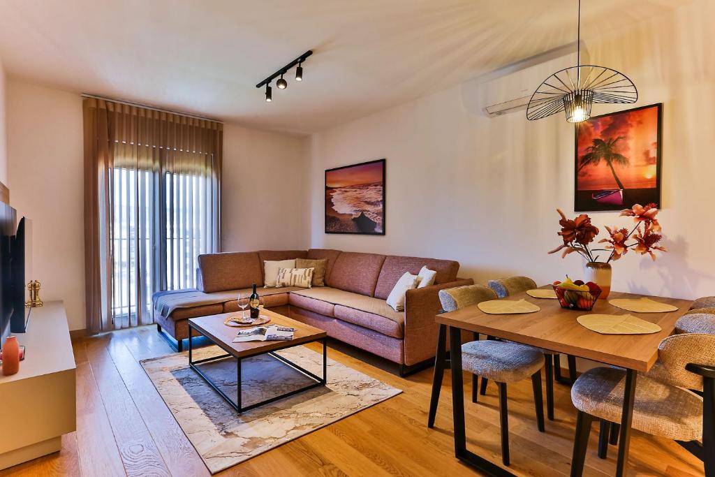 a living room with a couch and a table at Numa by Kraft in Podgorica