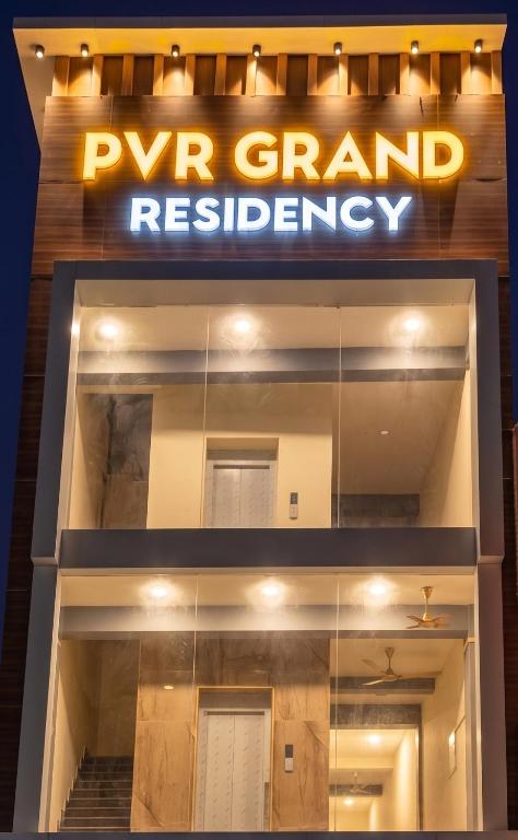 a sign that readsrw grand residency in front of a building at PVR Grand Residency in Tiruvannāmalai