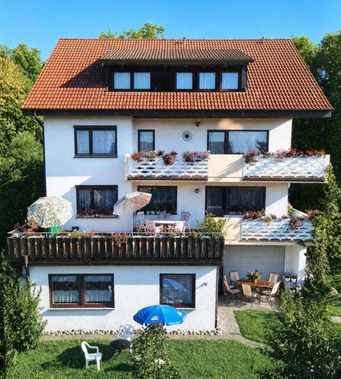 a large white house with a red roof at Ferienhaus Seehang in Meersburg