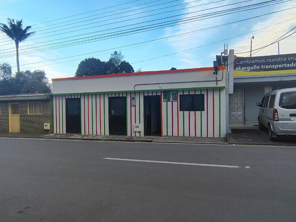 a car parked in front of a building at Hostal Perla Del Norte in Murillo