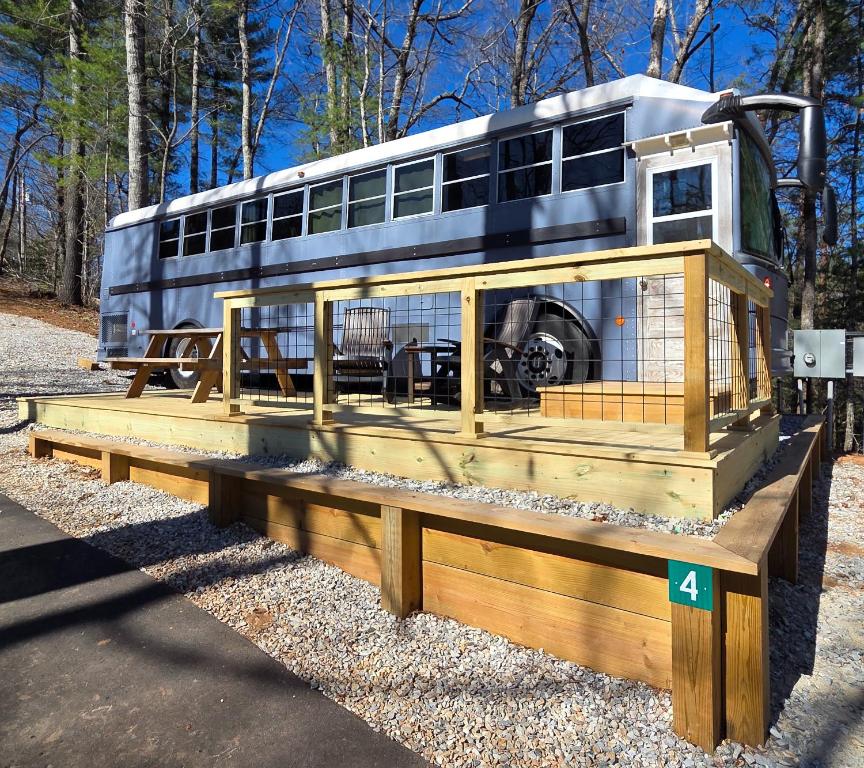 a bird cage with a bus on top of it at Lazy T Cabins - The Skoolie in Robbinsville