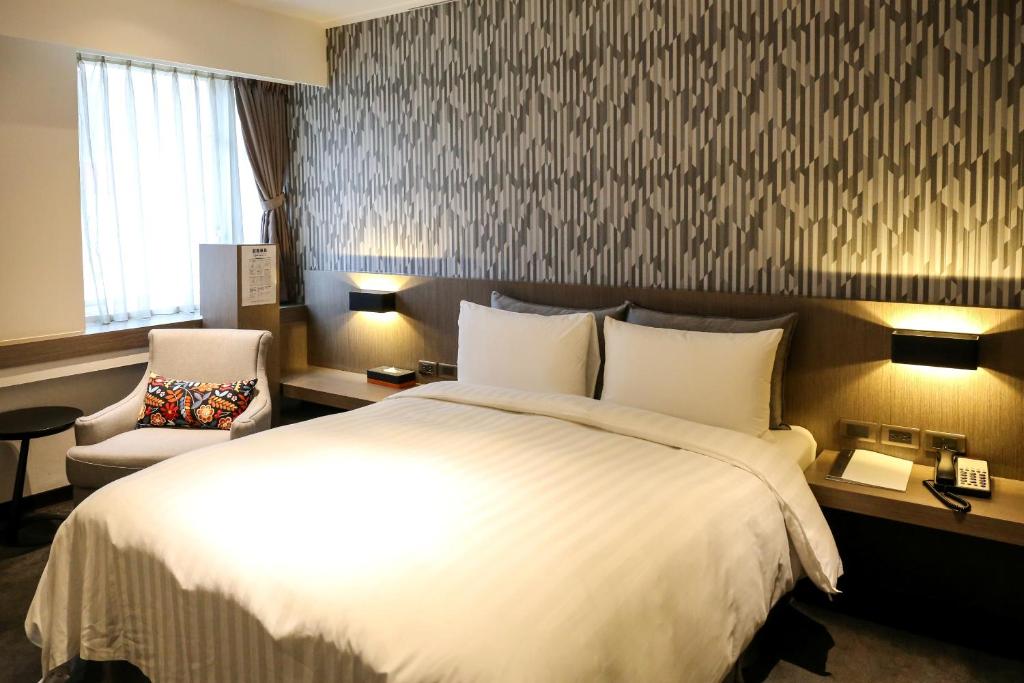 Postel nebo postele na pokoji v ubytování Wonstar Hotel