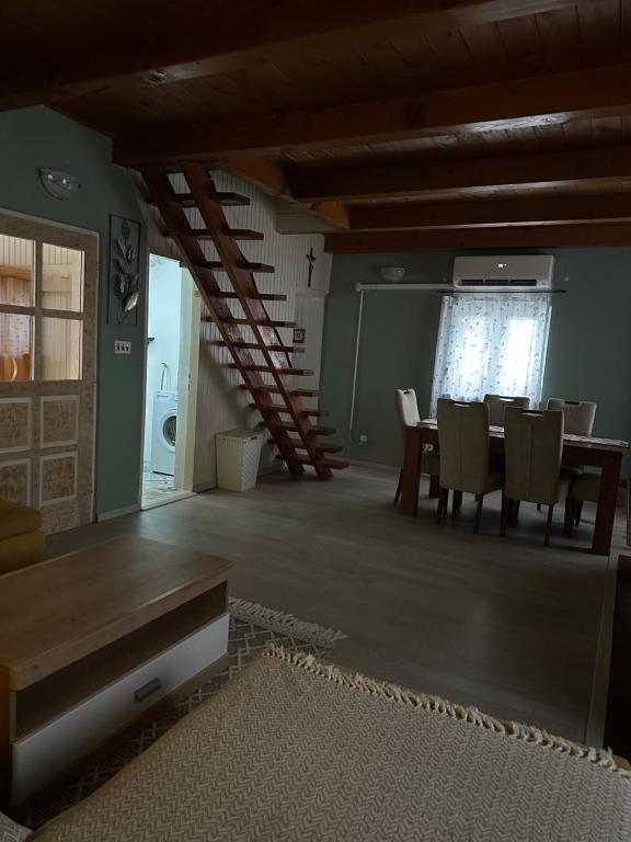 a dining room with a table and chairs at Forest Escape House in Begovo Razdolje
