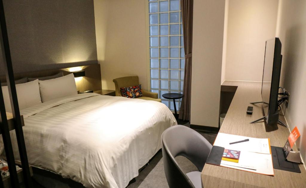 Postel nebo postele na pokoji v ubytování Wonstar Hotel