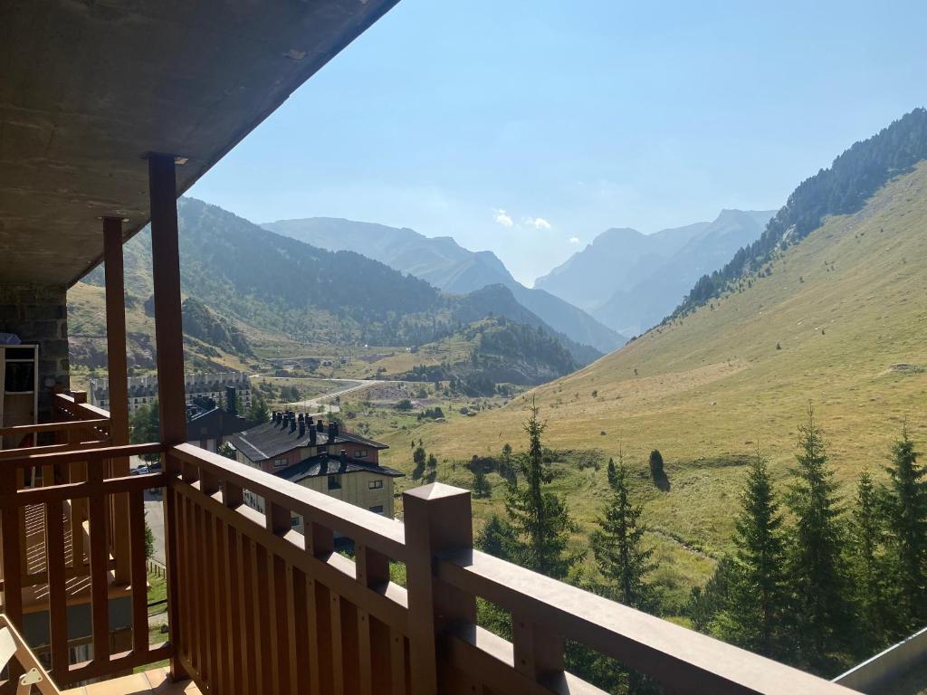 a balcony of a house with a view of a valley at Buenavista Candanchu in Candanchú