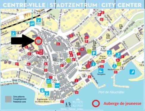 a map of a city with a red arrow at Studio au cœur de la ville de Neuchatel in Neuchâtel