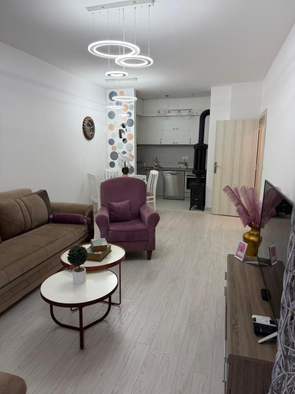 a living room with a couch and a table at Apartman VIA in Žabljak