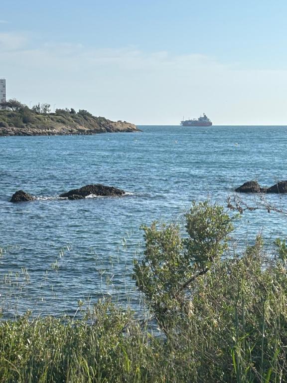 a large body of water with rocks in it at Chez Aurore in Port-de-Bouc