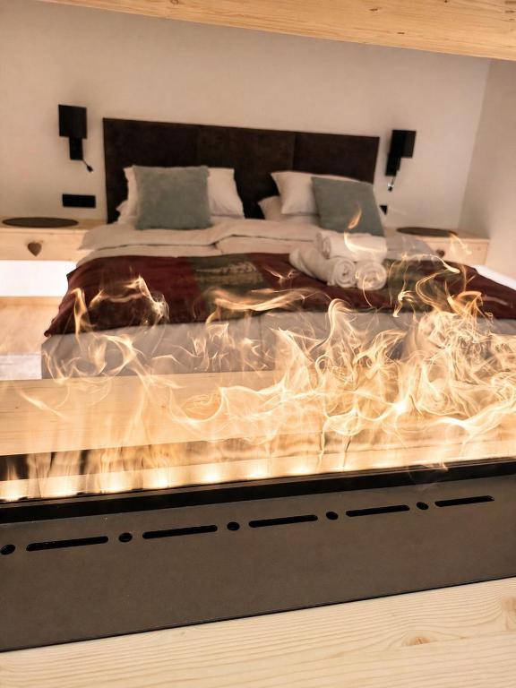 a bedroom with a large bed with at Bohinj Mountain Dreams in Bohinj