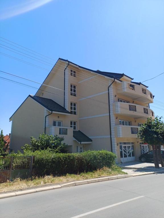 a large apartment building with a pointed roof at RIO Residence in Soko Banja
