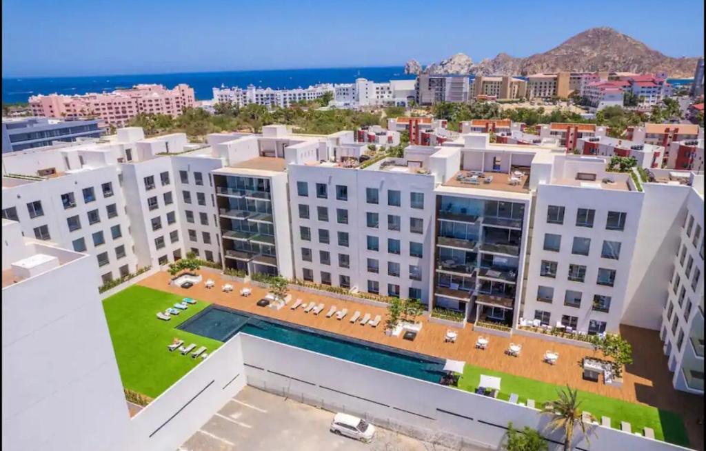 an aerial view of buildings in a city at 2BDR Condo Beach Downtown Jacuzzi Pool Amenities in Cabo San Lucas
