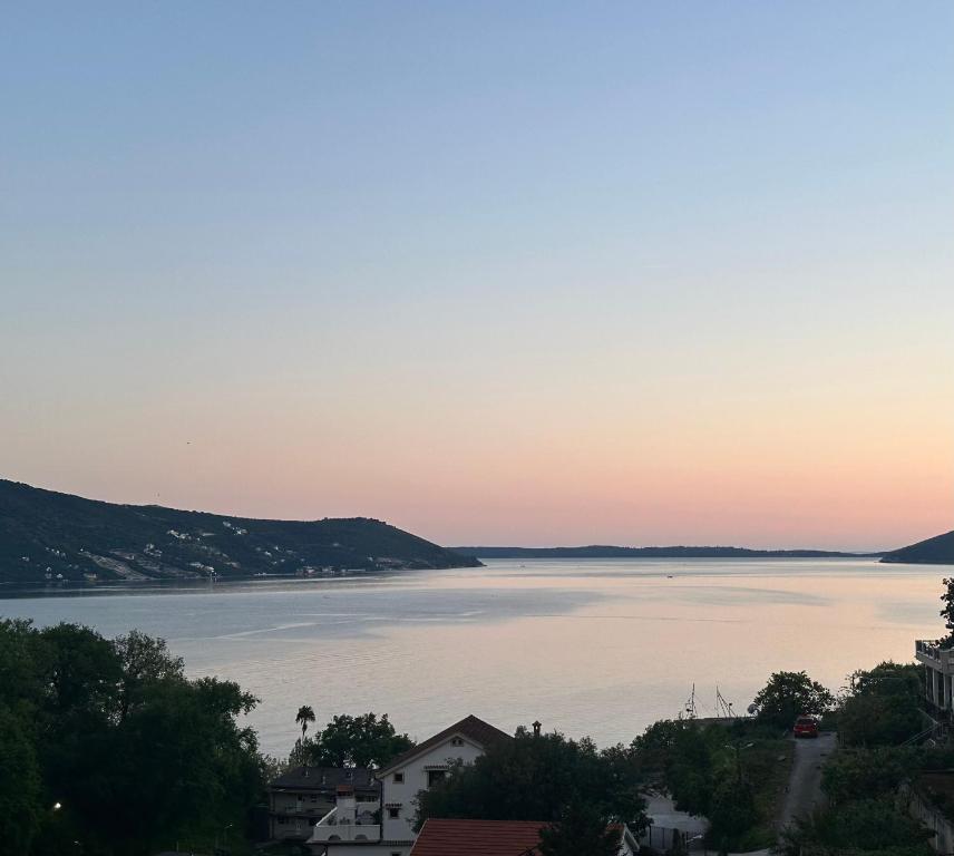 a view of a large body of water at sunset at Smolović Luxury Apartments Herceg Novi-Sea View,Free Parking in Zelenika