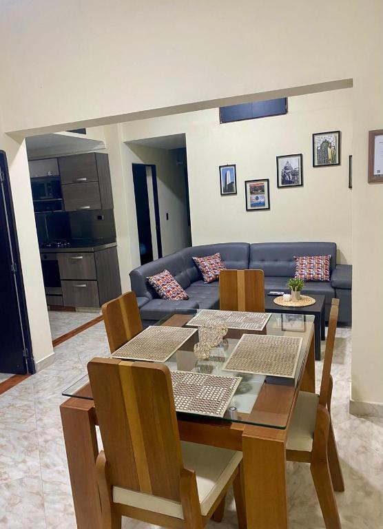 a living room with a table and a couch at fabuloso primer piso en envigado in Envigado