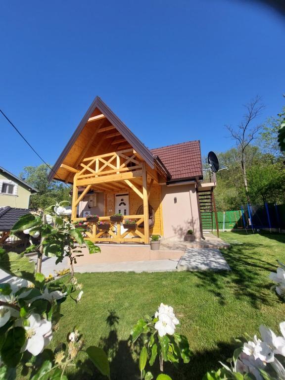a house with a wooden structure at Kuća za odmor "Moja idila" in Vrnjačka Banja