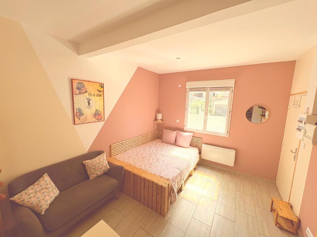 Llit o llits en una habitació de La petite Escapade