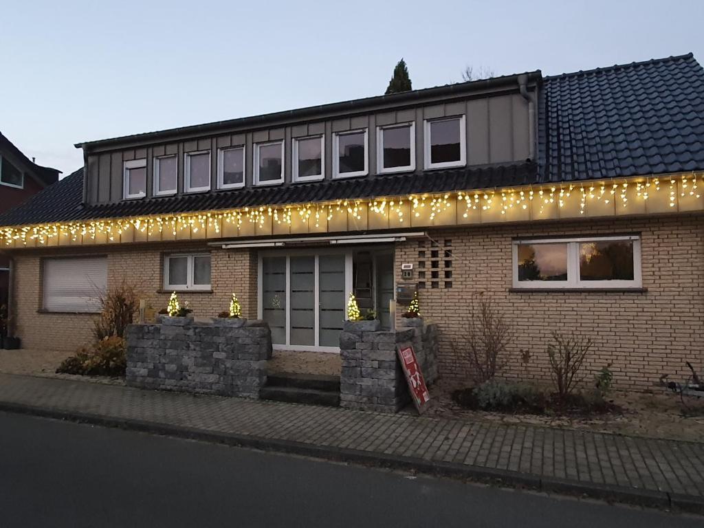 a brick house with christmas lights on it at Griesenstraße in Warendorf