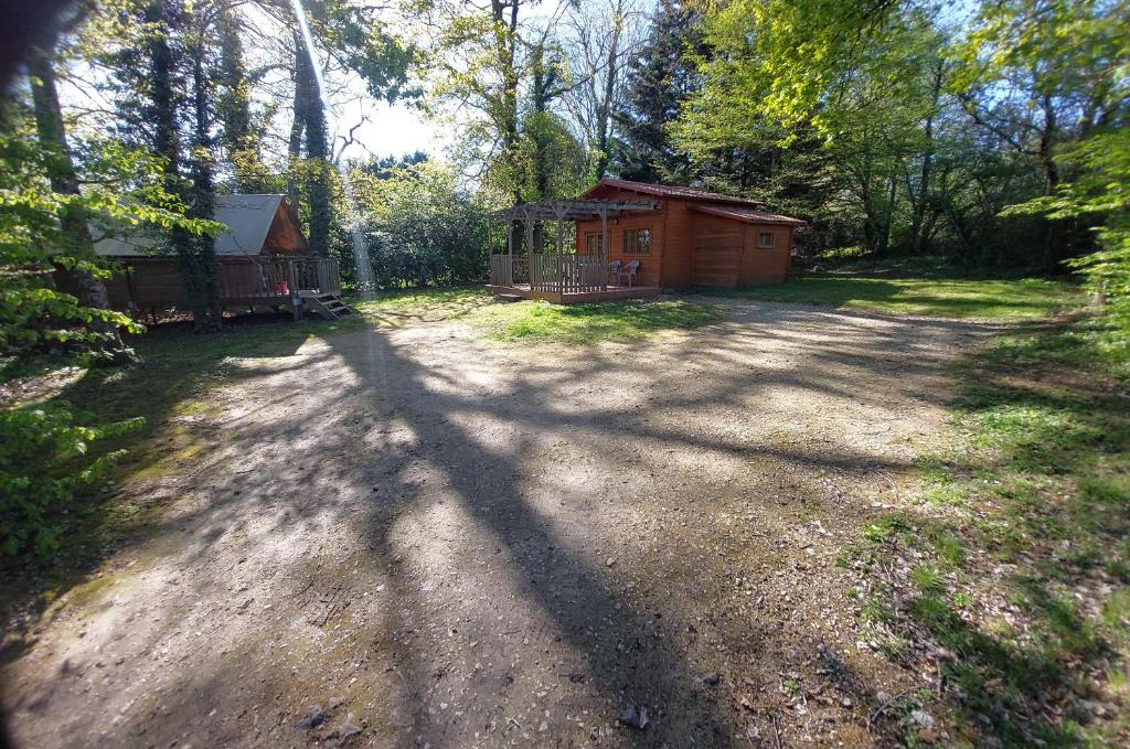 a house in the middle of a dirt road at Chalet l'écureuil in Treigny