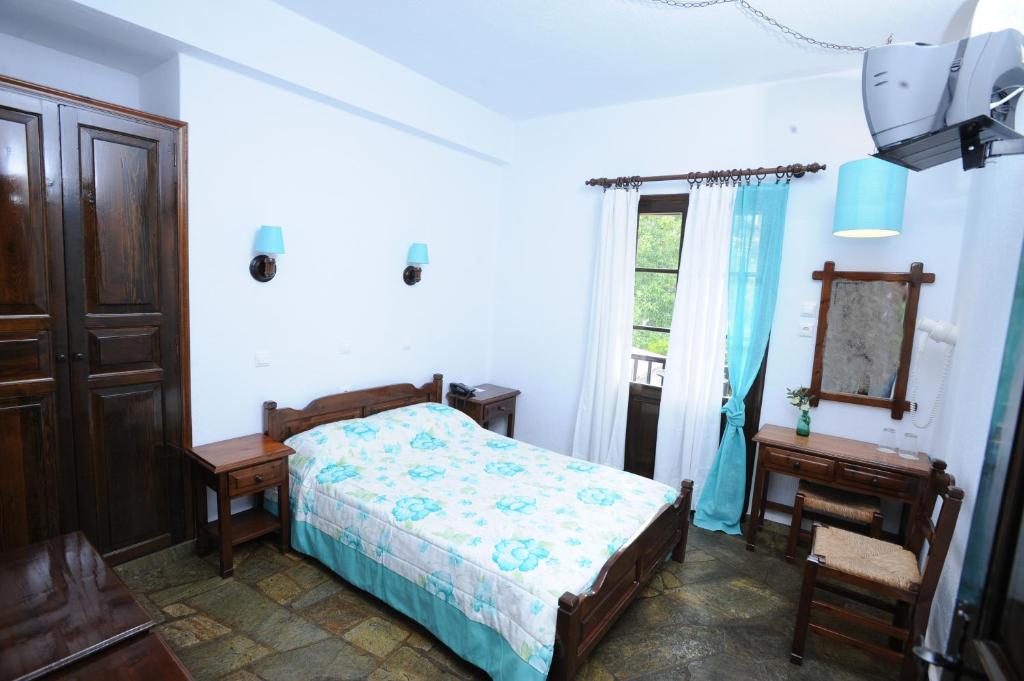 Postel nebo postele na pokoji v ubytování Elli Hotel